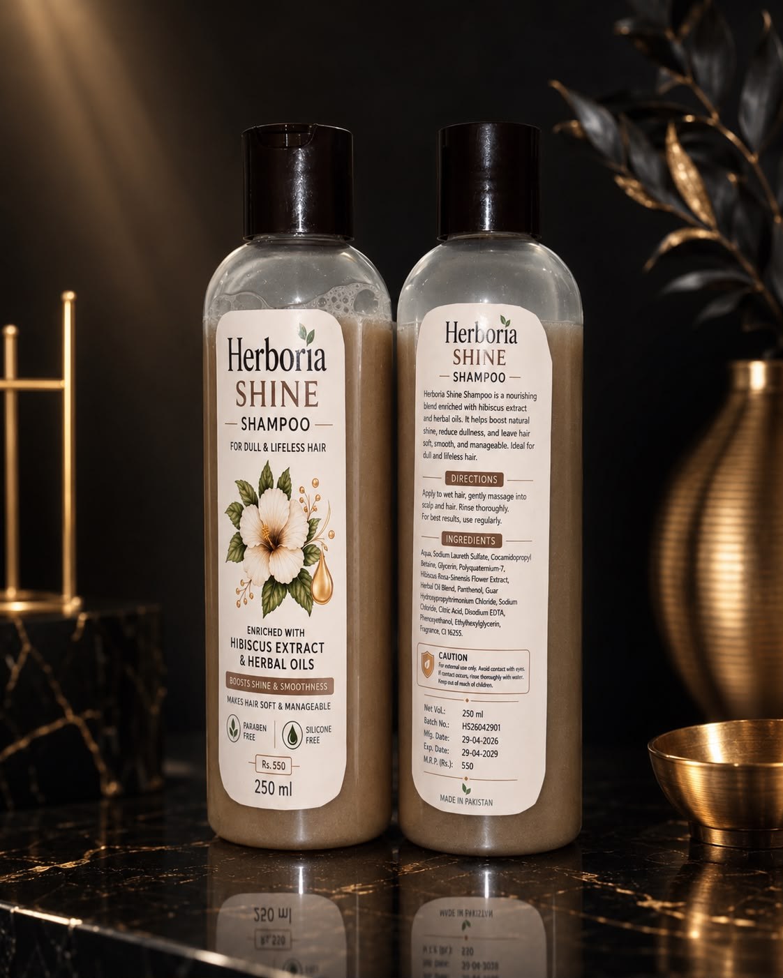Herboria Shine shampoo front and back bottles on dark background